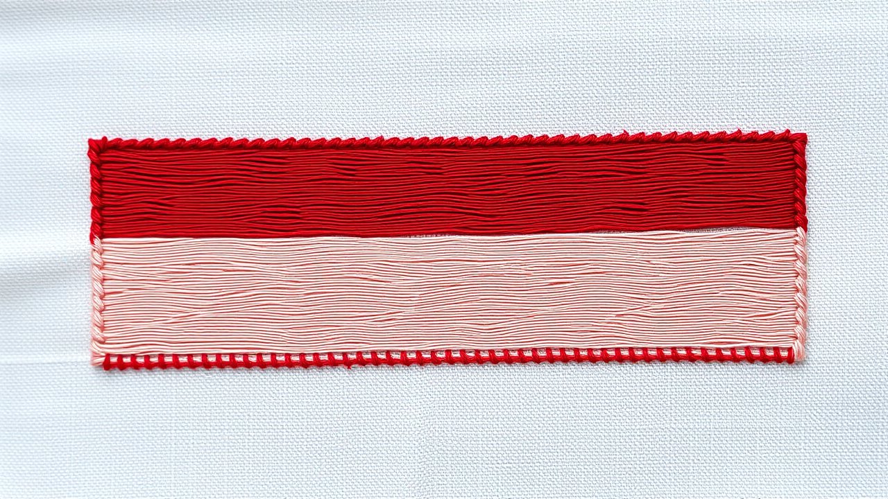 Flag of Indonesia 🇮🇩 in embroidered textile style