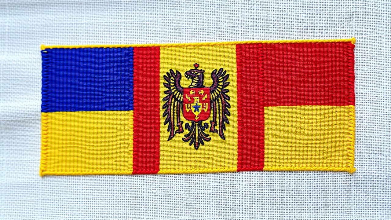 Flag of Moldova 🇲🇩 in embroidered textile style