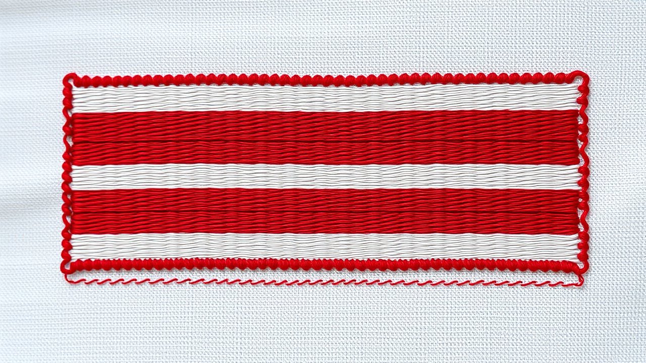 Flag of Austria 🇦🇹 in embroidered textile style
