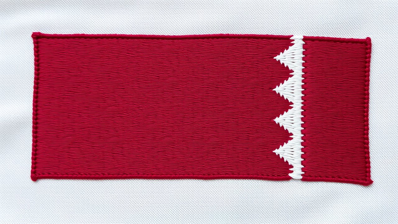 Flag of Qatar 🇶🇦 in embroidered textile style