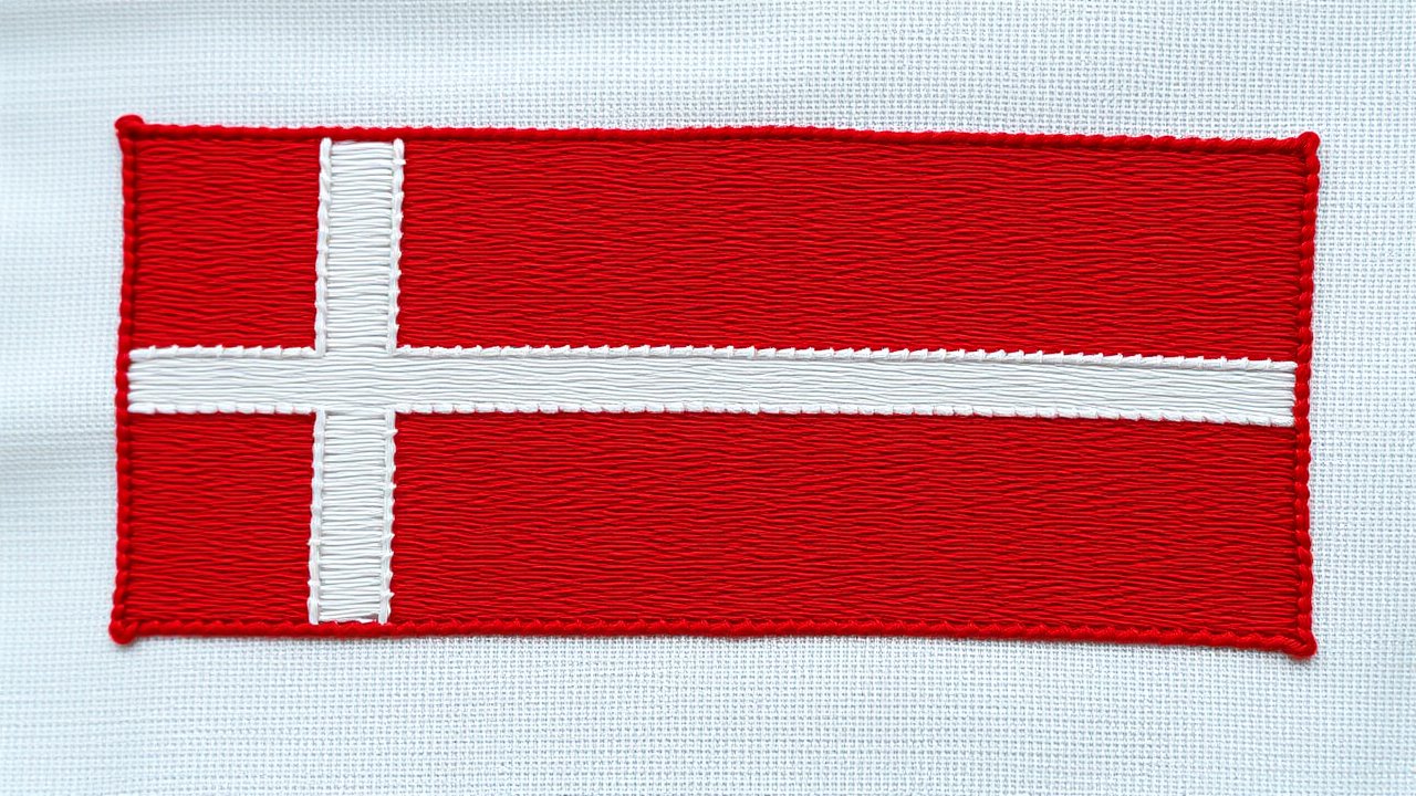 Flag of Denmark 🇩🇰 in embroidered textile style